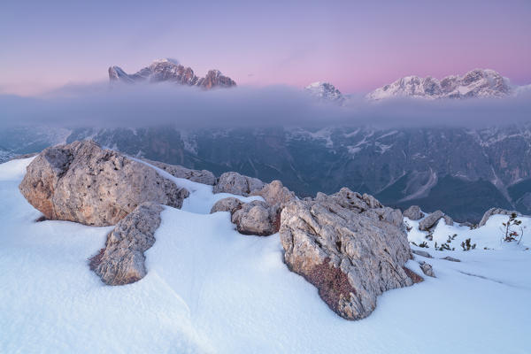 Europe, Italy, Veneto, Belluno, Agordino, Dolomites. Pristine snow at Palazza Alta, Pelsa, Civetta group at dusk