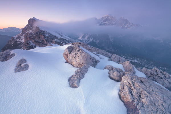 Europe, Italy, Veneto, Belluno, Agordino, Dolomites. Dusk with pristine snow on Palazza Alta mountain towards Civetta and Mont Alt of Pelsa