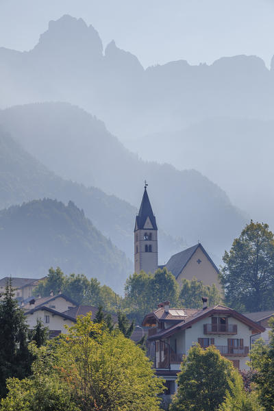 Europe, Italy, veneto, Belluno. La Valle Agordina with the main church and Tamer Moschesin mountains in the background