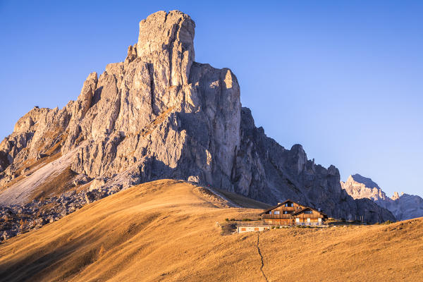 lonely chalet at the feet of La Gusela of the Averau, Dolomites, Giau pass, Colle Santa Lucia, Belluno, Veneto, Italy