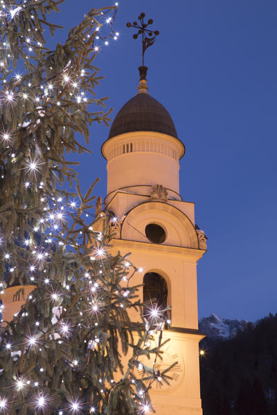 The bell tower of the church of Agordo at Christmas time, Agordo, Belluno, Veneto, Italy