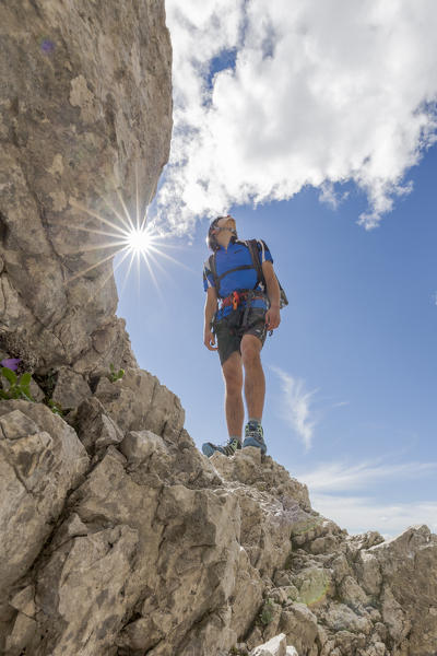 Europe, Italy, Veneto, Agordino, mountain climber on the via ferrata Stella Alpina at mount Agner, Pale di San Martino, Dolomites
