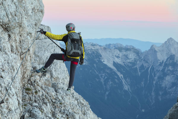 Europe, Italy, Veneto, Agordino, mountain climber on the via ferrata Stella Alpina at mount Agner, Pale di San Martino, Dolomites