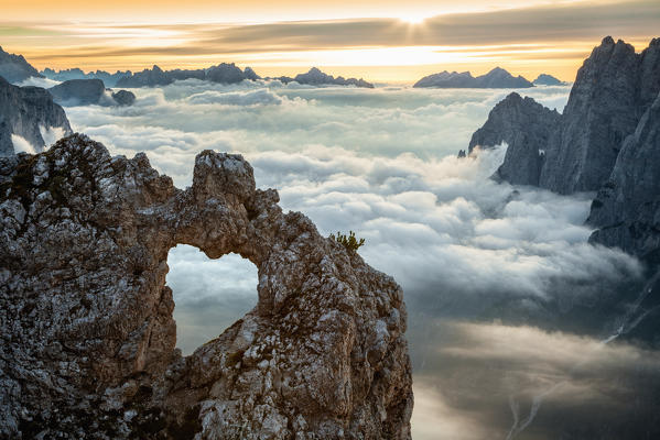 Europe, Italy, Veneto, Belluno. The rock heart of San Lucano valley over the clouds, Agordino, Dolomites