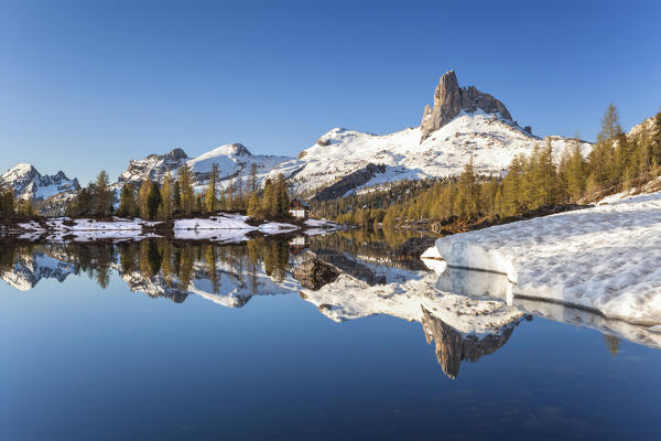 Snowmelt the lake Federa, Shelter Palmieri at Croda da Lago, Dolomites, Belluno, Veneto, Italy