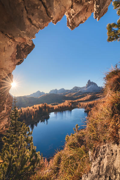 Federa lake in autumn framed in a rock window, Croda da Lago, Dolomites, Cortina d Ampezzo, Belluno, Veneto, Italy