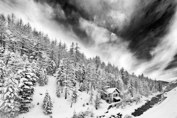 Chisone Valley, Piedmont,Turin, Italy. White winter house black and white