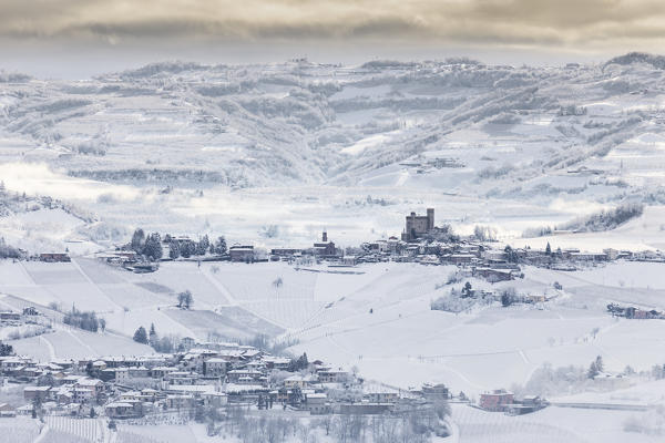 Langhe, Cuneo district, Piedmont, Italy. Langhe wine region winter snow, Serralunga castle
