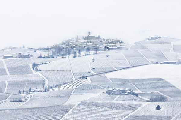 Langhe, Cuneo district, Piedmont, Italy. Langhe wine region winter snow, Castiglione Falletto castle
