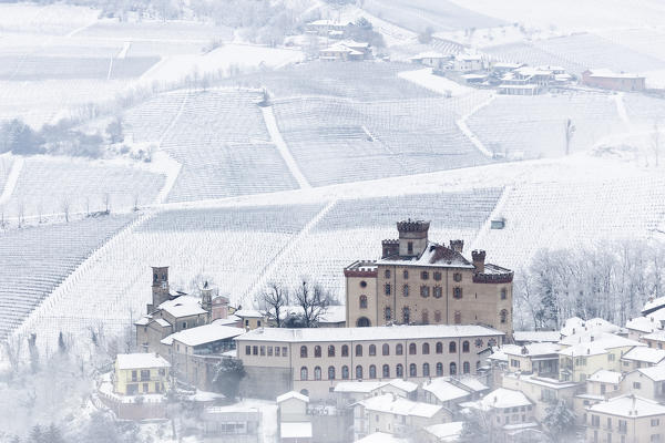 Langhe, Cuneo district, Piedmont, Italy. Langhe wine region winter snow, Barolo castle
