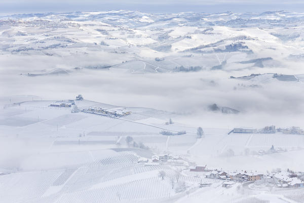 Langhe, Cuneo district, Piedmont, Italy. Langhe wine region winter snow,cedar of the langhe