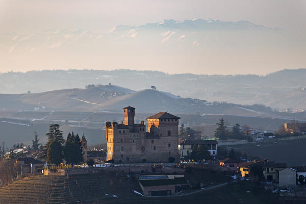 Langhe, Cuneo district, Piedmont, Italy. Langhe wine region winter,sunset over the Grinzane castle
