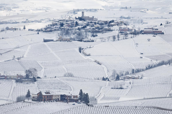 Langhe, Cuneo district, Piedmont, Italy. Langhe wine region winter snow, Castiglione Falletto castle
