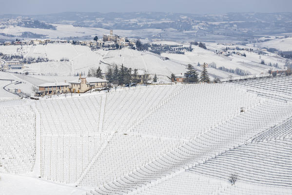Langhe, Cuneo district, Piedmont, Italy. Langhe wine region winter snow, Castiglione Falletto castle