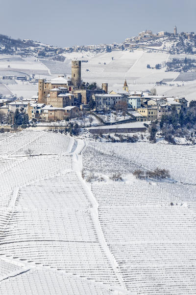Langhe, Cuneo district, Piedmont, Italy. Langhe wine region winter snow, Castiglione Falletto castle