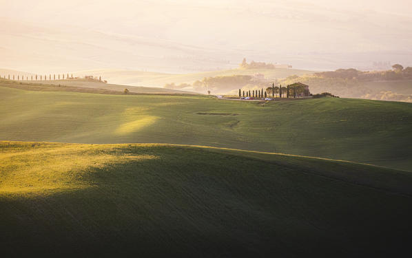 Early morning between Val d'Orcia Hills. Pienza, Val d'Orcia, Siena Province, Tuscany, Italy.