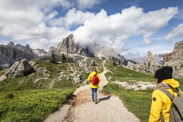 Peolpe walking in Cinque Torri natural Park, Cortina d'Ampezzo, Belluno province, Dolomites, Veneto, Italy