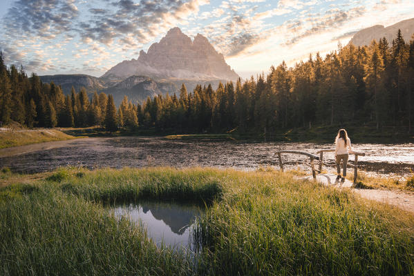 Sunrise view of Tre Cime di Lavaredo reflecting on Antorno Lake. Sesto Dolomites, South Tyrol, Italy