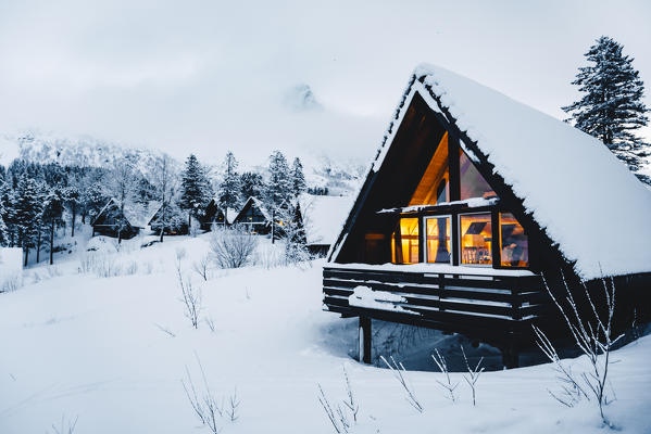 Cozy house covered with fresh snow in Svolvaer. Lofoten Islands, Nordland, Norway.