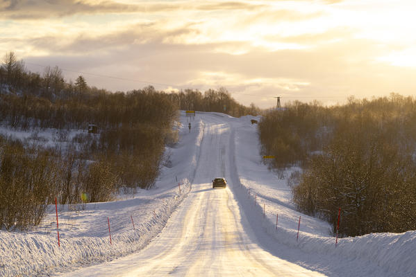 A countryside road covered with snow just near Svolvaer city. Lofoten Islands, Nordland, Norway.