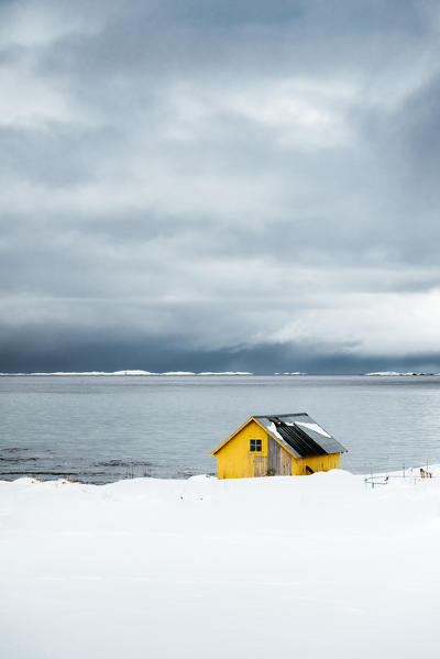 A solitary yellow house in Lofoten Islands, Nordland, Norway.