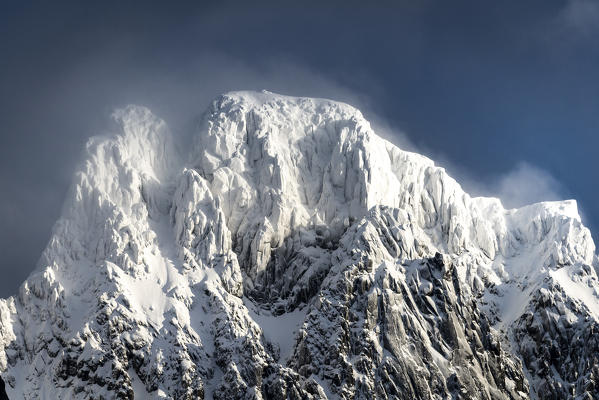 Mountain top covered by fresh snow, Lofoten Islands, Nordland, Norway.