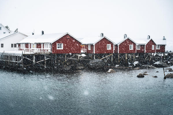 Hamnoy village with snowflakes, Reine Bay, Lofoten Islands, Nordland, Norway.