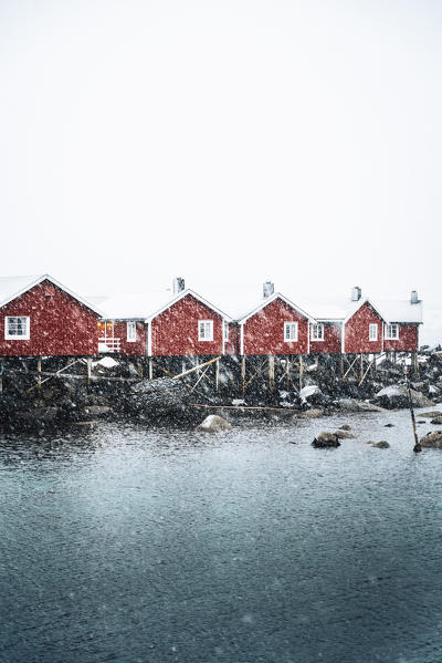 Hamnoy village with snowflakes, Reine Bay, Lofoten Islands, Nordland, Norway.