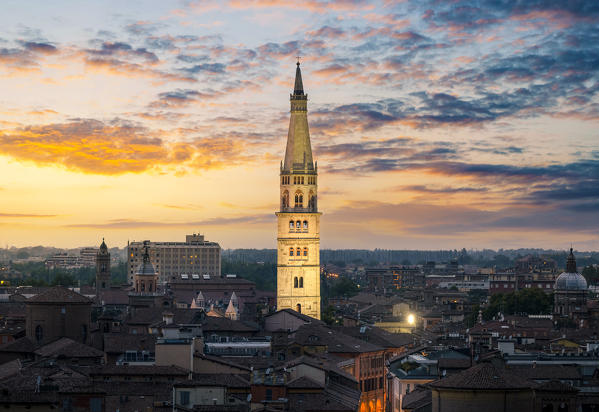 The city of Modena with its tower named Ghirlandina, during sunset. Modena, Emilia Romagna, Italy
