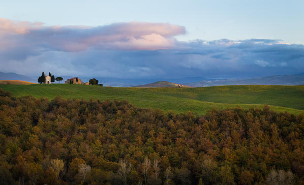 San Quirico d'Orcia, Tuscany, Italy. Sunset over Vitaleta Chapel, with a  very cloudy sky.