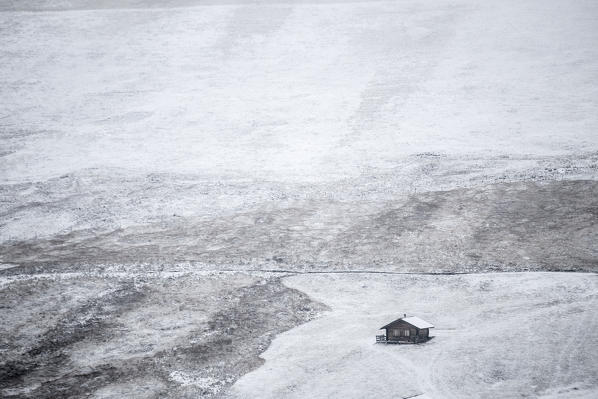 A little house covered by snow into Puez Odle Natural Park, South Tyrol, Italy