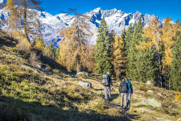 Some hikers into Brenta Dolomites National Park, South tyrol, Italy