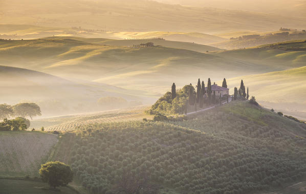 Podere Belvedere, the famous italian farmhouse, during sunrise. Val d'Orcia, Siena province, Tuscany, Italy