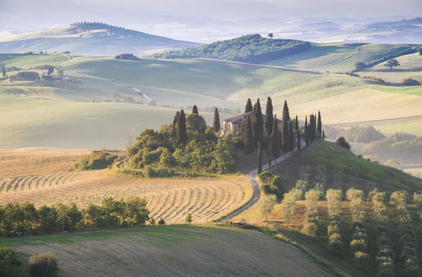 Podere Belvedere, the famous italian farmhouse, during sunrise. Val d'Orcia, Siena province, Tuscany, Italy