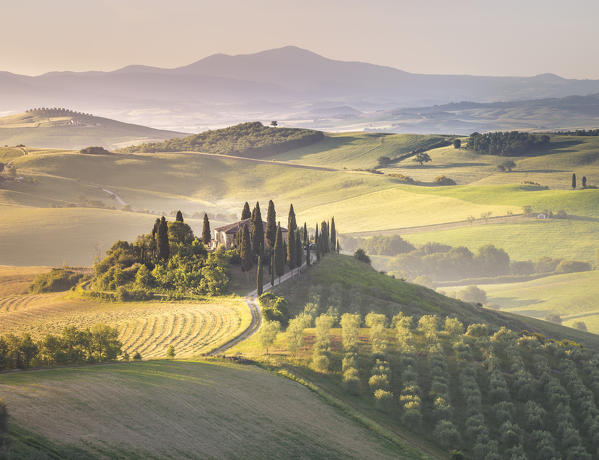 Podere Belvedere, the famous italian farmhouse, during sunrise. Val d'Orcia, Siena province, Tuscany, Italy