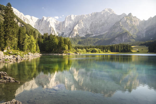 Superior Fusine Lake with Mount Mangart on the background. Fusine Lakes Natural Park, Tarvisio, Udine province, Friuli Venezia Giulia, Italy.