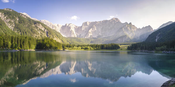 Superior Fusine Lake with Mount Mangart on the background. Fusine Lakes Natural Park, Tarvisio, Udine province, Friuli Venezia Giulia, Italy.