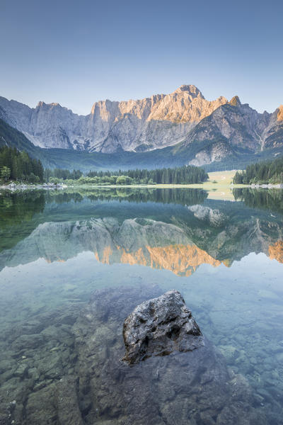 Superior Fusine Lake with Mount Mangart on the background. Fusine Lakes Natural Park, Tarvisio, Udine province, Friuli Venezia Giulia, Italy.