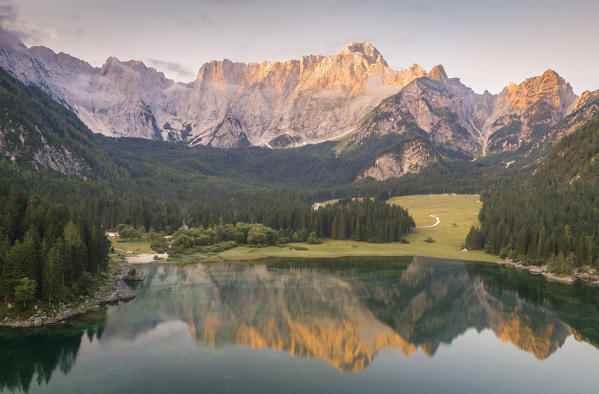 Aerial view of superior Fusine Lake with Mount Mangart on the background. Fusine Lakes Natural Park, Tarvisio, Udine province, Friuli Venezia Giulia, Italy.