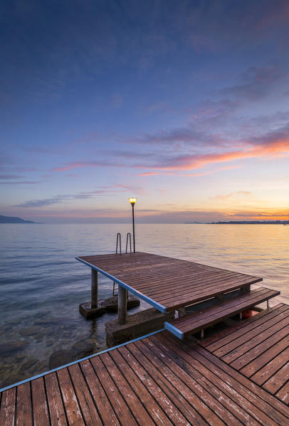 A pier near Toscolano Maderno village, on Garda Lake. Brescia Province, Lombardy, Italy