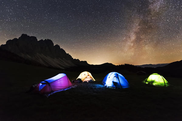 Odle,Funes, Dolomites,Trentino alto Adige, Italy
The Odle group resumed in the night.In first floor four tents with lights on in four different colors 