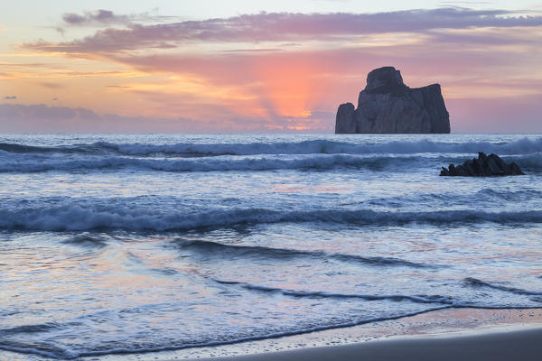 The sunset is reflected on the Beach of Masua, Iglesias