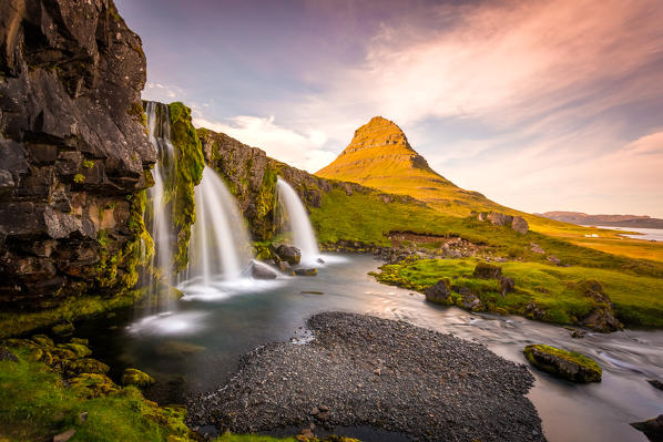 Kirkjufell Mountain, Snaefellsnes peninsula, Iceland. Landscape with waterfalls, long exposure in a sunny day