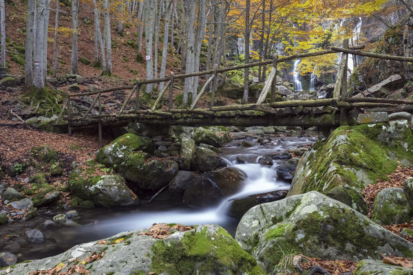 Wooden bridge at the Dardagna waterfalls, Corno Alle Scale Regional Park, Lizzano in Belvedere, Emilia Romagna, Italy.