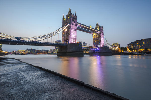 Night view of the Tower Bridge reflected in river Thames London United Kingdom
