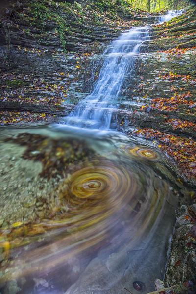 Waterfall in the forest in autumn, Monte Cucco NP, Umbria, Italy