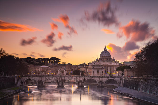 Rome, Lazio, Italy. Sunset on Tevere River, with Saint Peter Cathedral on the background.